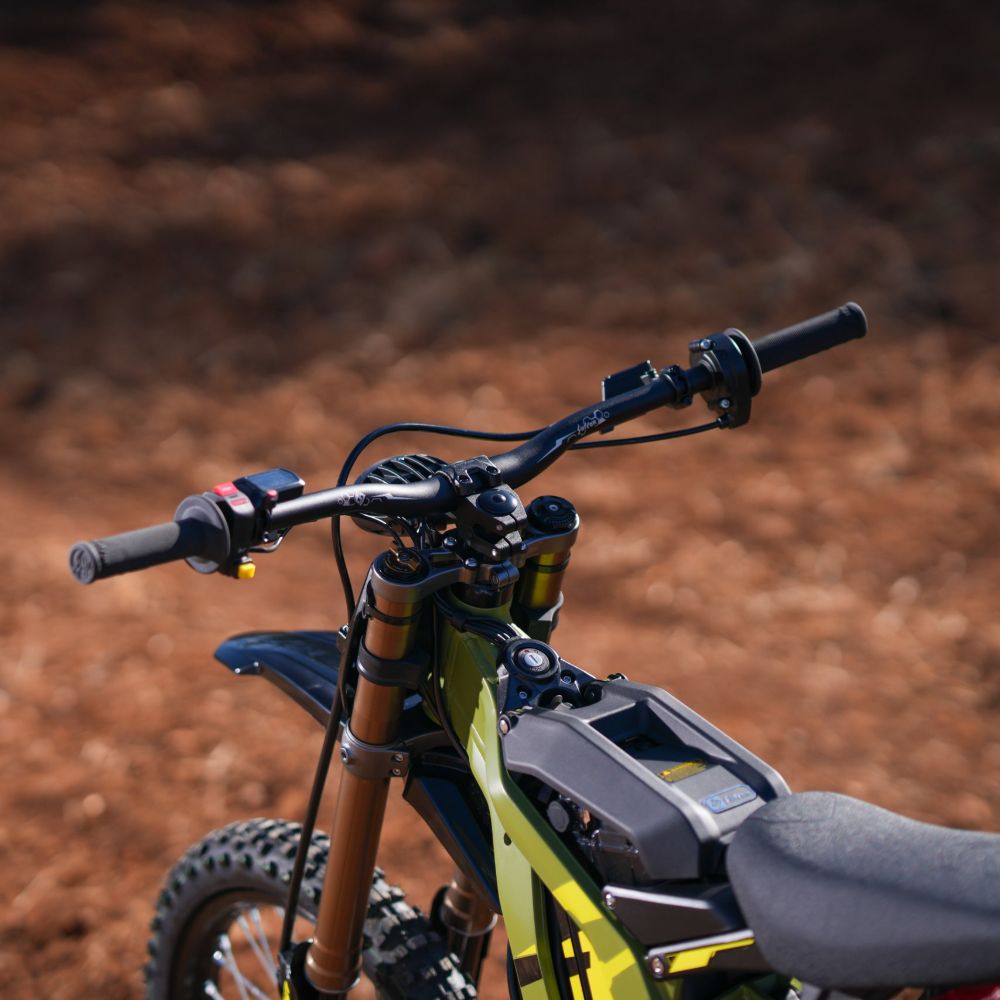 Surron Light Bee X handlebar and control detail electric dirt bike cockpit view