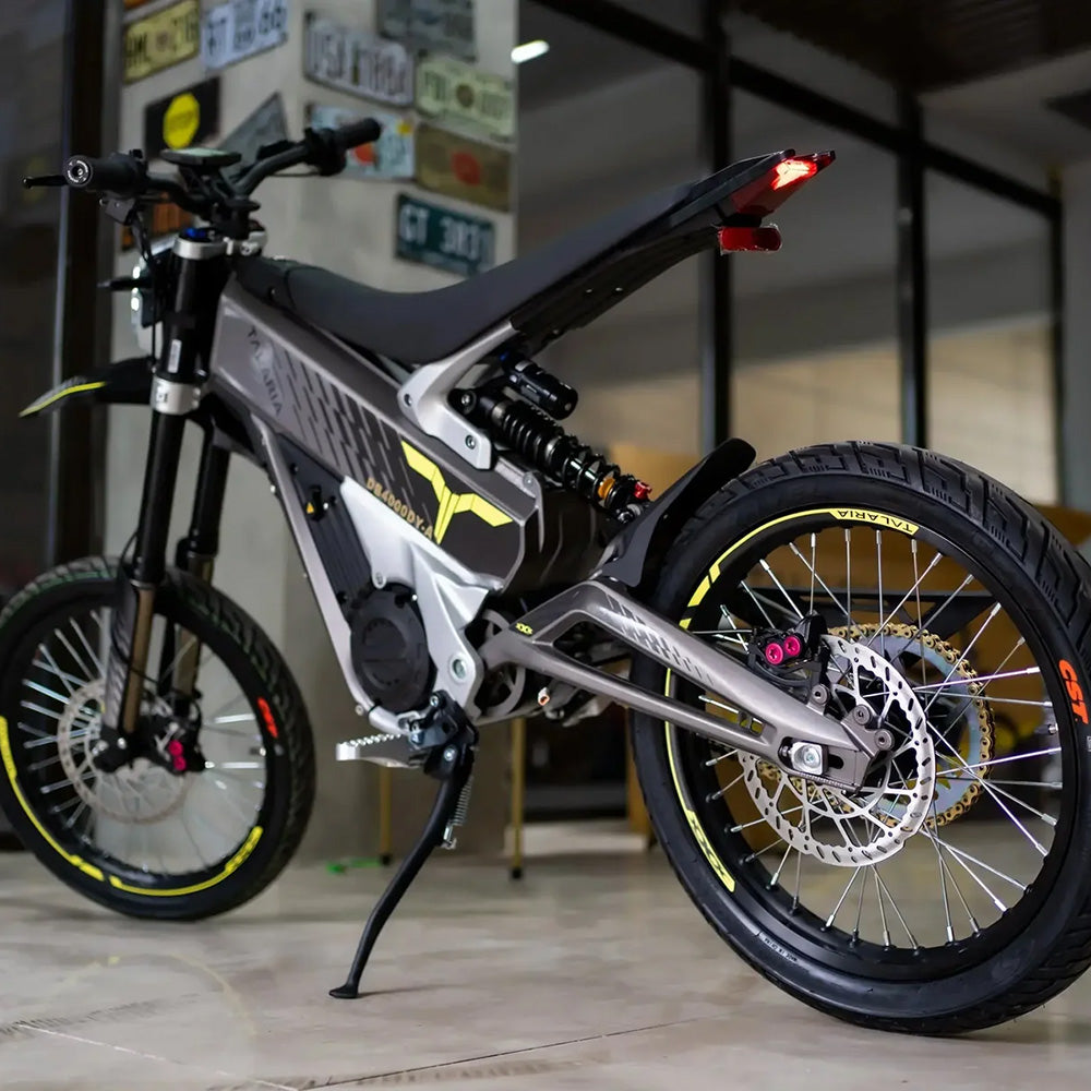 Talaria XXX electric dirt bike rear angle showcasing suspension, disc brakes, and off-road tires, designed for high-performance riding