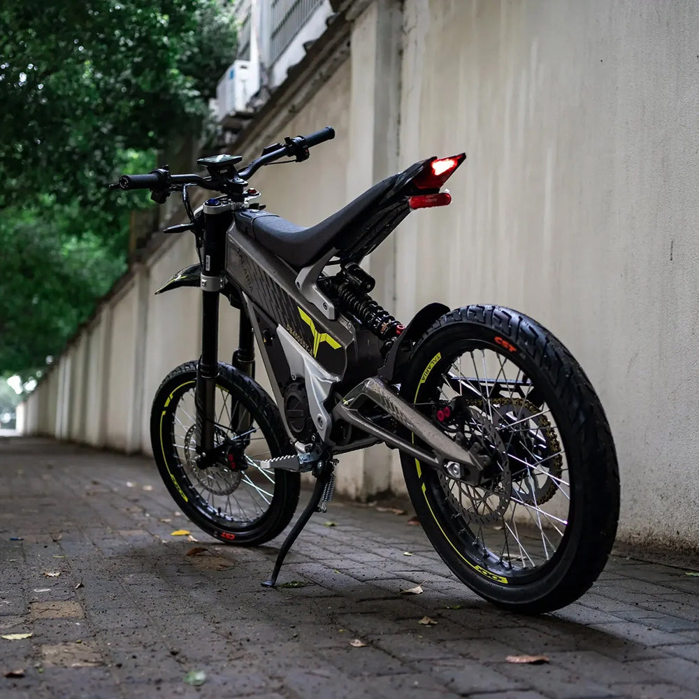 Rear view of Talaria XXX electric dirt bike, highlighting off-road tires, suspension system, and sleek frame design for urban and trail riding