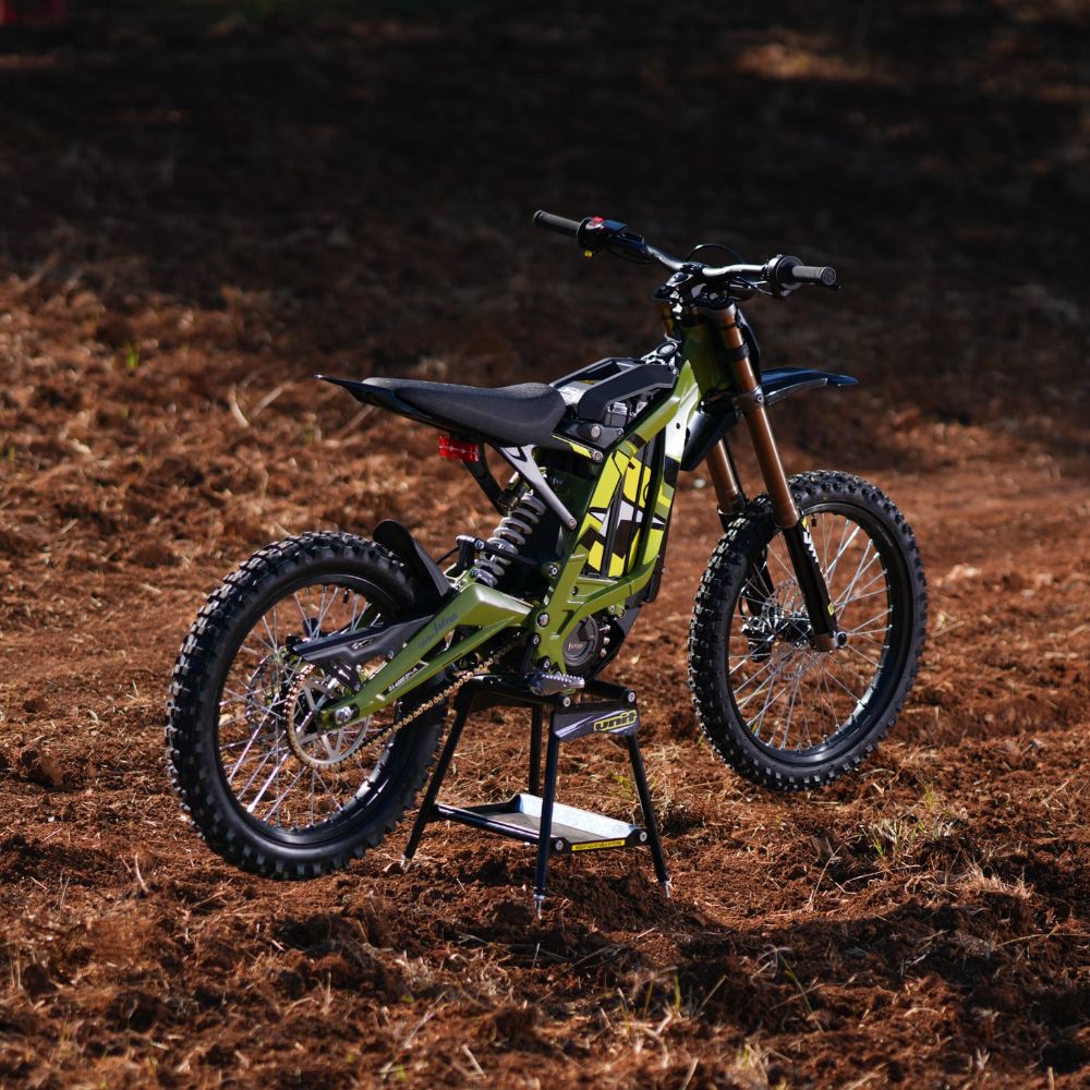 Surron Light Bee X off road riding electric dirt bike in dirt terrain high performance e-bike